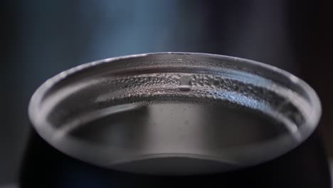 close-up of a condensation-covered metal bowl