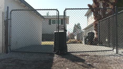 locked back alley fence to a yard