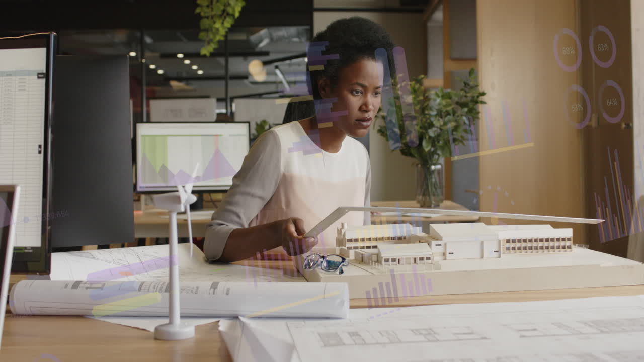 Animation of infographic interface over african american architects measuring 3d model of building