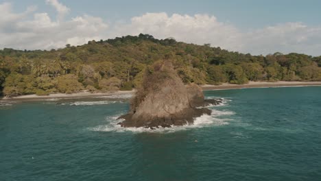 cinematic drone aerial of rock formations in the sea of costa rica