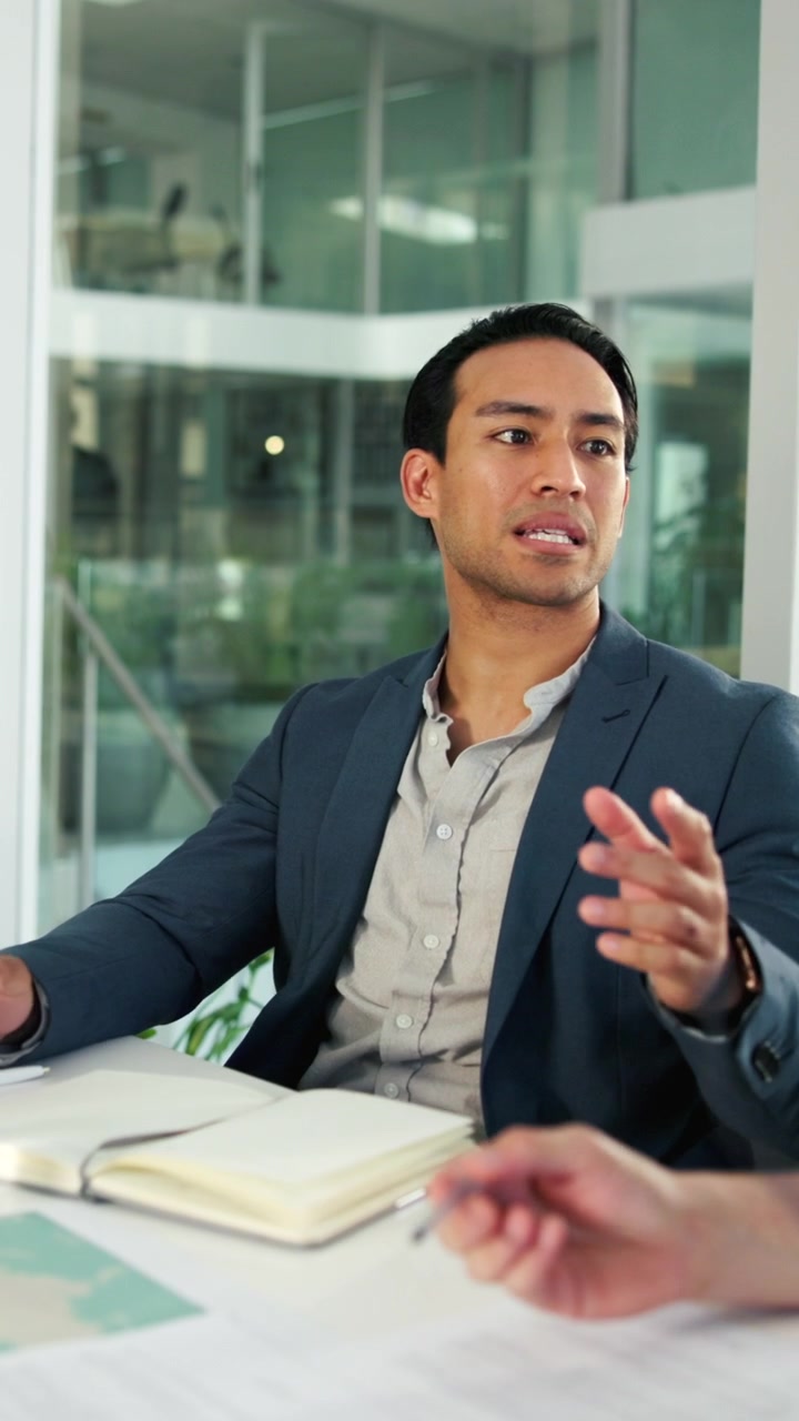 Professional Businessman Discussing Strategy in a Modern Office Meeting