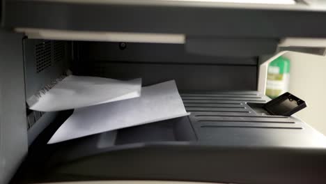 close up shot of office printer document in the process are working and the sheets copier with white paper