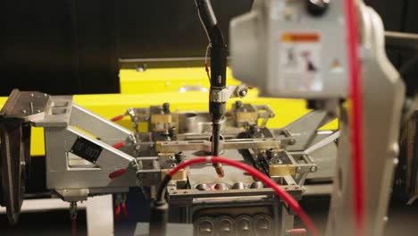 colse up shot of an automated welding machine, welding a complex steel frame