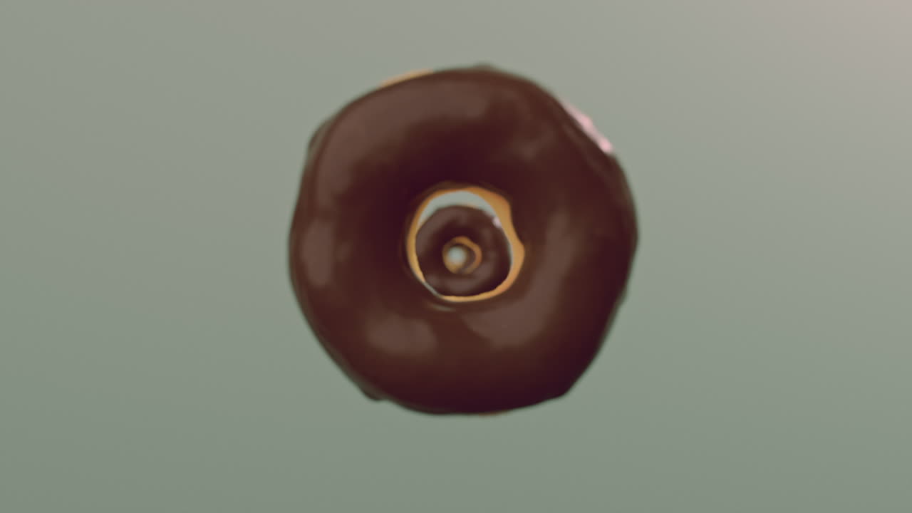 Chocolate glaze donuts on a mint background