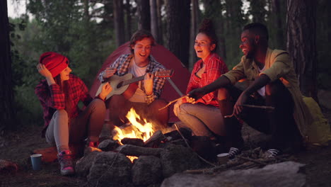 friends enjoying a campfire evening