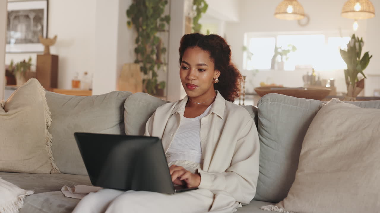 Woman Working on Laptop at Home