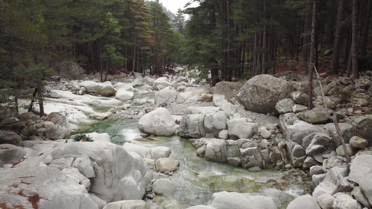 Low aerial shot of wonderful river stream with waterfalls in Restonica Valley