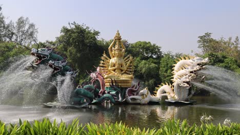 sculpted beasts spouting water in a pond