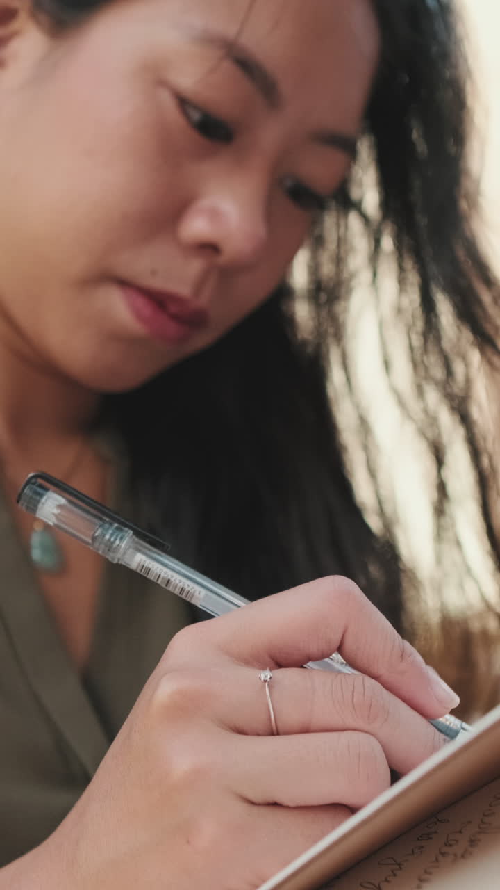 Woman writing in a notebook