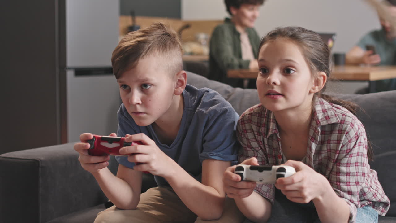 Cute Siblings Playing Video Games