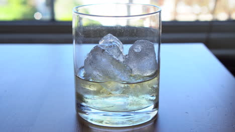 bartender making a long drink with tequila and tonic water