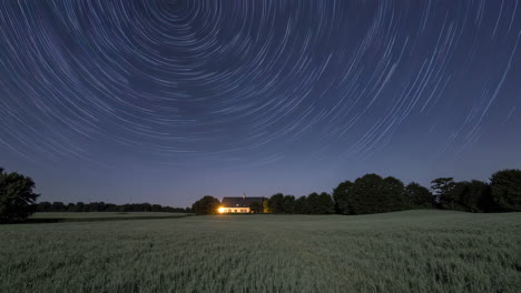 star trails over a farmhouse