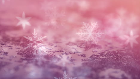 animation of multiple snowflakes falling over pink surface