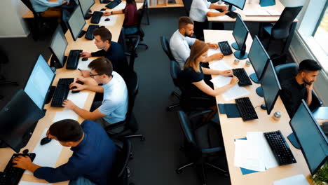 employees working in a modern office computer lab