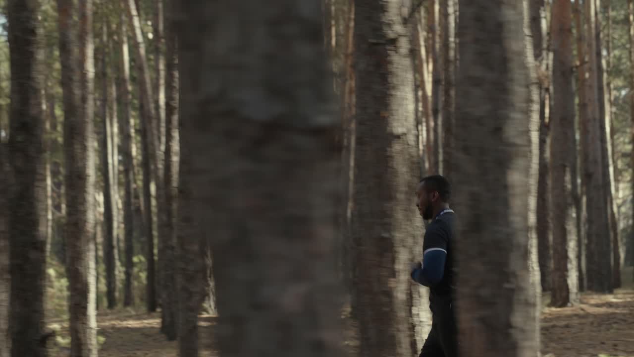 Man Running in a Forest