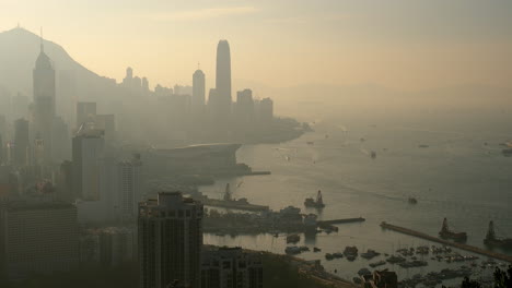 high view overlooking victoria harbour including both hong kong island and kowloon at late afternoon