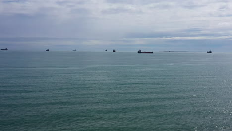 mediterranean sea with oil tankers in background cloudy day aerial shot
