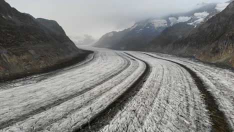 aerial flyover over the longest glacier in the alps - the aletsch glacier in valais, switzerland - with motion towards jungfrau