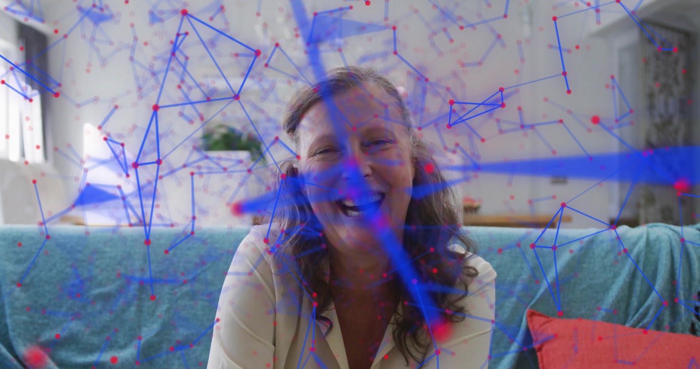 Woman smiling at camera on sofa, causing network lines and nodes materializing for technology demo