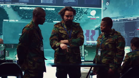 diverse army officers examining real time data on a hologram