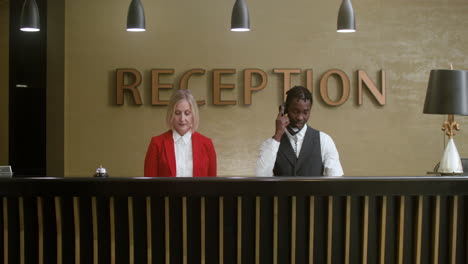 hotel receptionists in the hotel hall