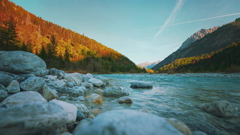 Mountain-river-with-vibrant-autumn-sky