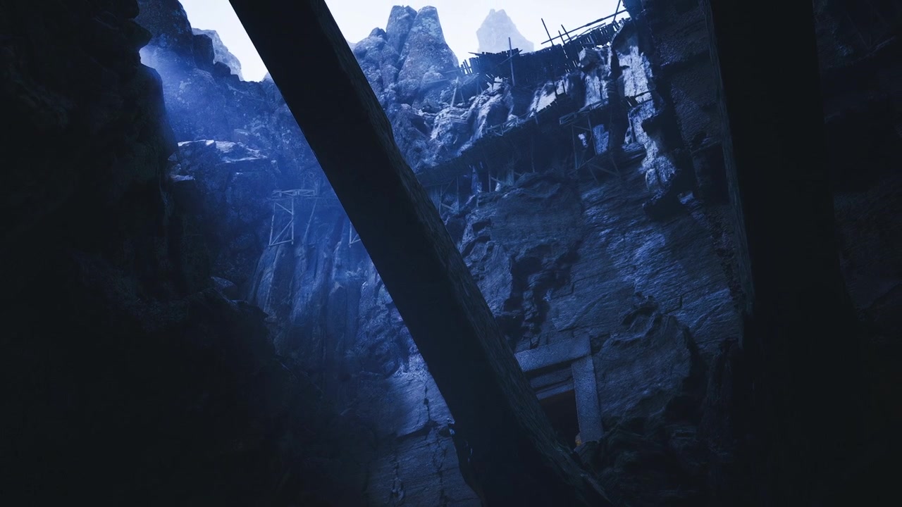Enormous stone columns with rugged surfaces and shadowed recesses