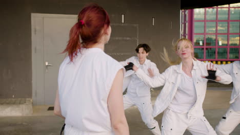Red-haired-woman-showing-the-choreography-to-the-group