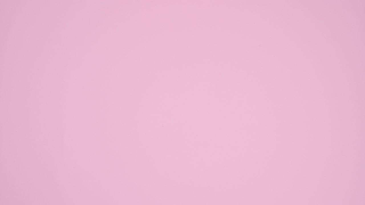 Hands put and take pastel pink gift with ribbon on pastel pink theme. Stop motion