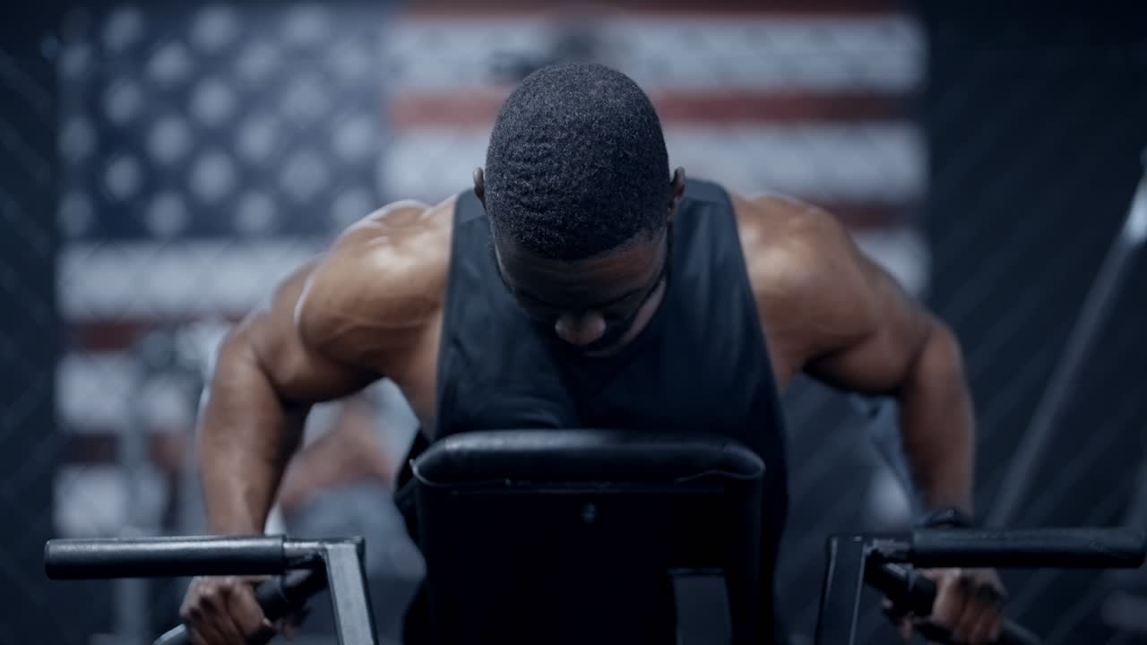 African American man performs weighted exercise