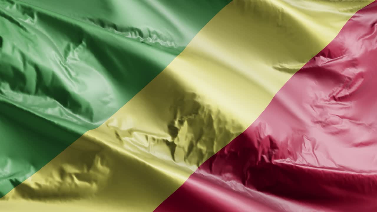 la bandera de la república del congo ondeando en el bucle del viento. la bandera de las repúblicas del congo balanceándose en la brisa. fondo de relleno completo. bucle de 10 segundos.
