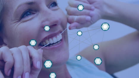limpiando los dientes con hilo dental, mujer con iconos de salud dental y animación de red