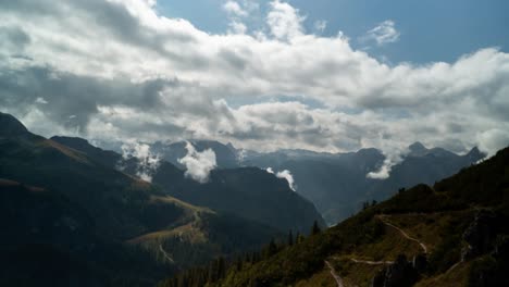 timelapse of clouds on top mountains in the middle of day in bavaria, germany