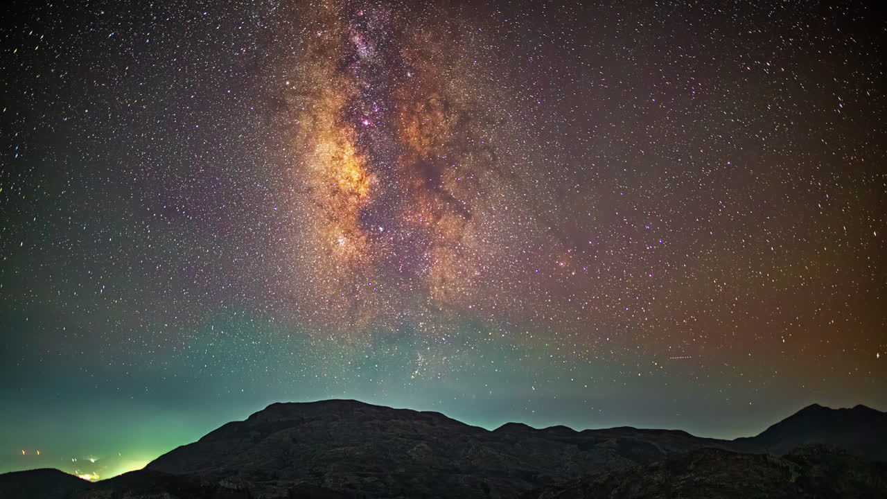 Milky Way time lapse from the Skinakas Observatory on Crete, Greece with purple airglow over the mountains