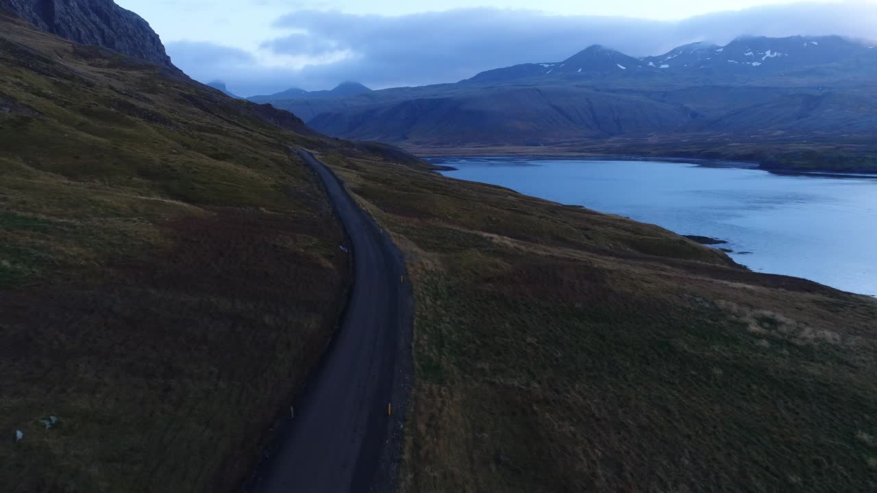 Desert road next to a lake, drone view