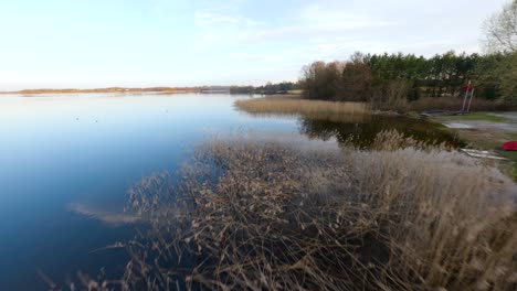 Flight-Above-The-Shore-Of-Elk-Lake-In-Elk,-Mazury,-Poland