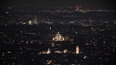 Milan-city-nightscape-with-churches,-aerial-drone-view