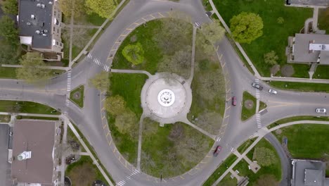 Traffic circle downtown Marshall, Michigan with drone video looking down stable shot