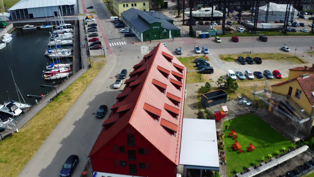 Aerial view of Port of Klaipeda canal with Old Mill Hotel and ships on a summer day - Lithuania