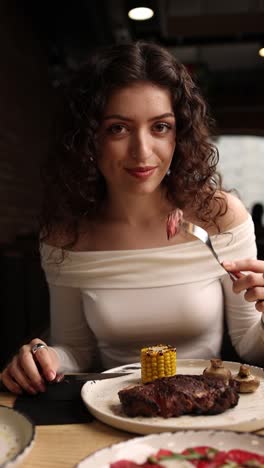 woman enjoying a steak dinner