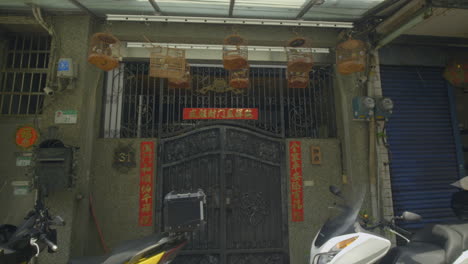 songbirds in cages at a typical home in urban taipei taiwan