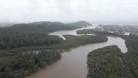 Aerial-View-Of-Tallebudgera-Creek-Surrounded-By-Forested-Landscape-In-Gold-Coast,-Queensland,-Australia