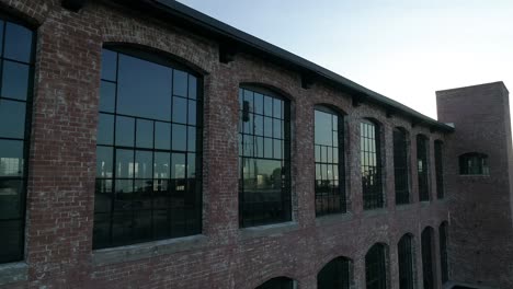 cotton mill factory in downtown mckinney texas during sunrise near the millhouse and the water tower