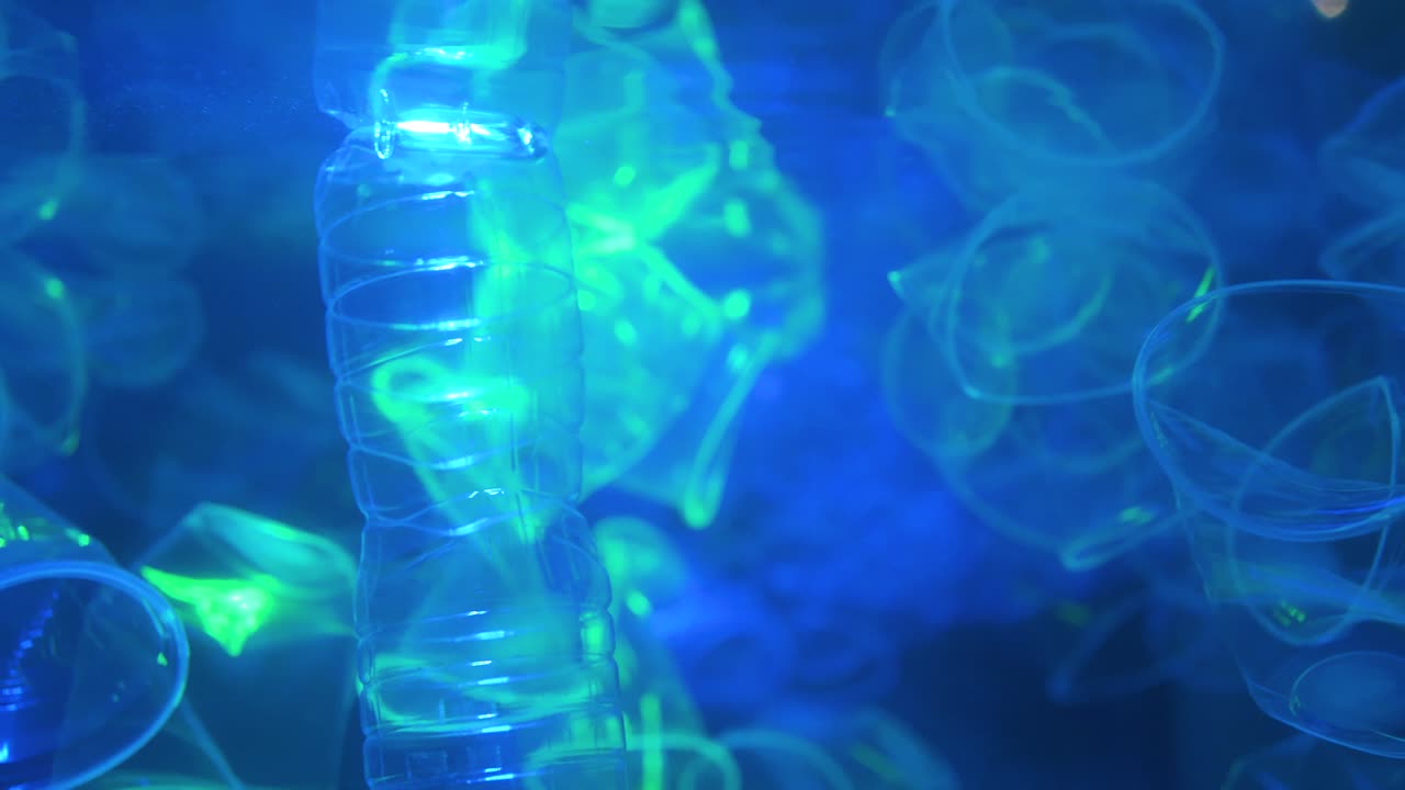 Bottle falling down loop of slow motion in background.Plastic waste in the Pacific ocean.Video 4K Resolutions.
