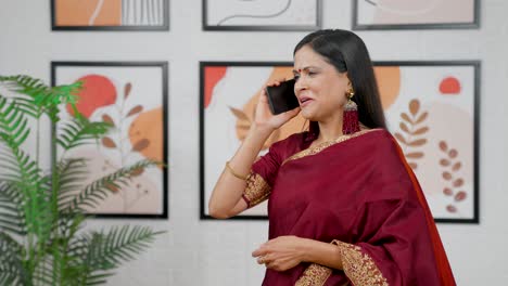 Happy-Indian-woman-talking-on-a-call