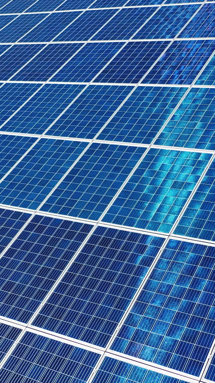 Detail shot of solar panel. Background of photovoltaic modules for renewable energy. Vertical video