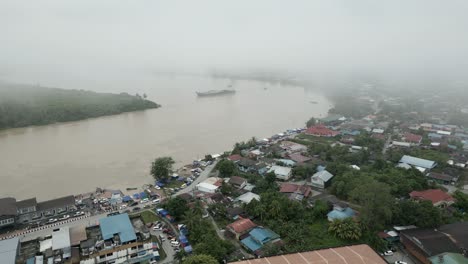 foggy morning beautiful drone view of sri aman town at batang lupar river, during regatta and pesta benak,sarawak, borneo.