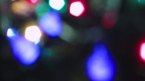 blurred christmas abstract colorful lights are burning brightly.