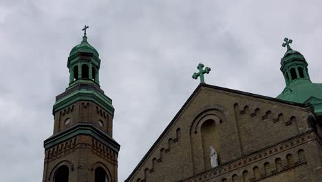 old brick catholic cathedral steeples cloud timelapse