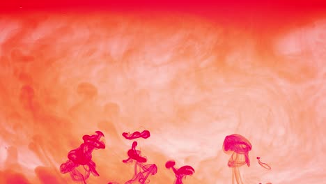 contra un fondo anaranjado nublado y neblinoso, las columnas de tinta rosa ascienden, creando una pantalla abstracta y colorida